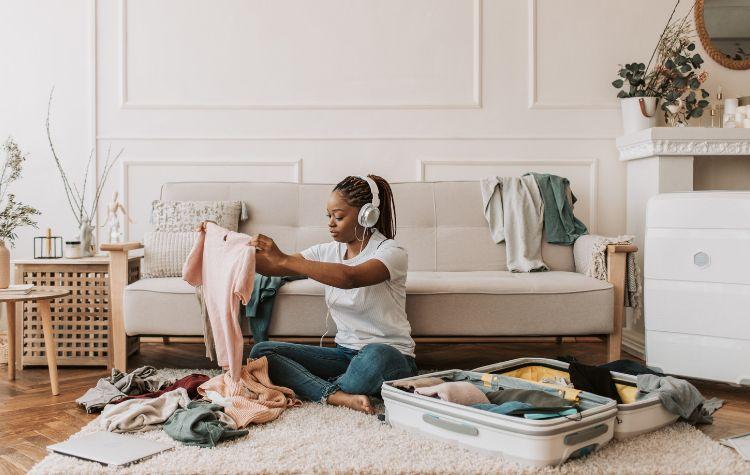 A girl packing in her room