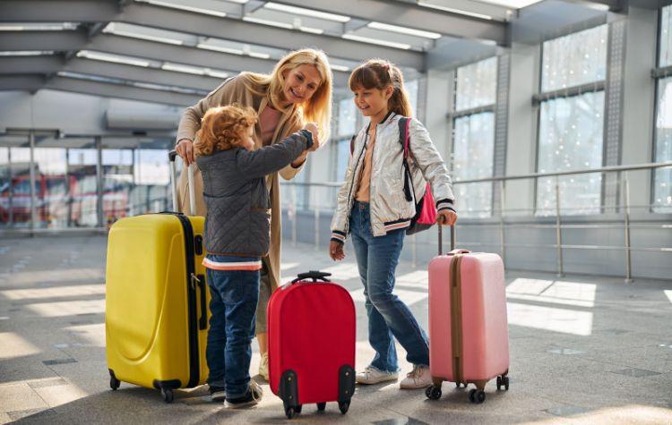 A mother interacting with her children at the airport