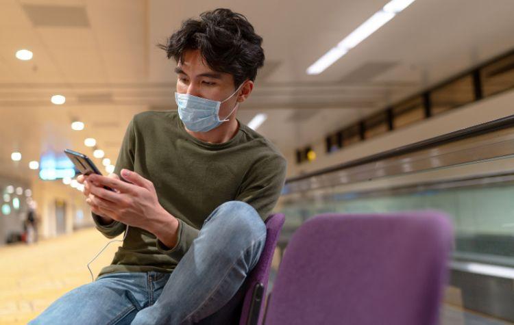 A person wearing a mask at the airport