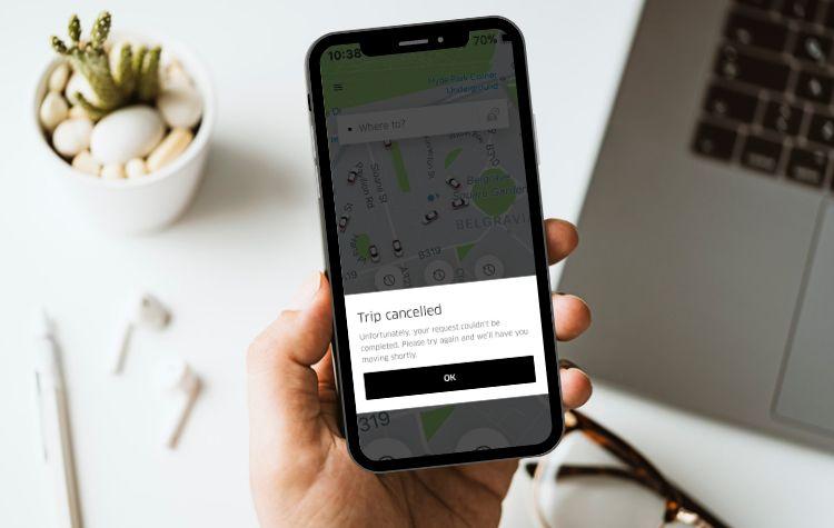 A phone receiving a trip cancelled notification from uber