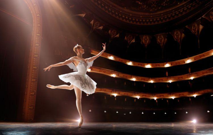 Ballerina performing in a grand theater