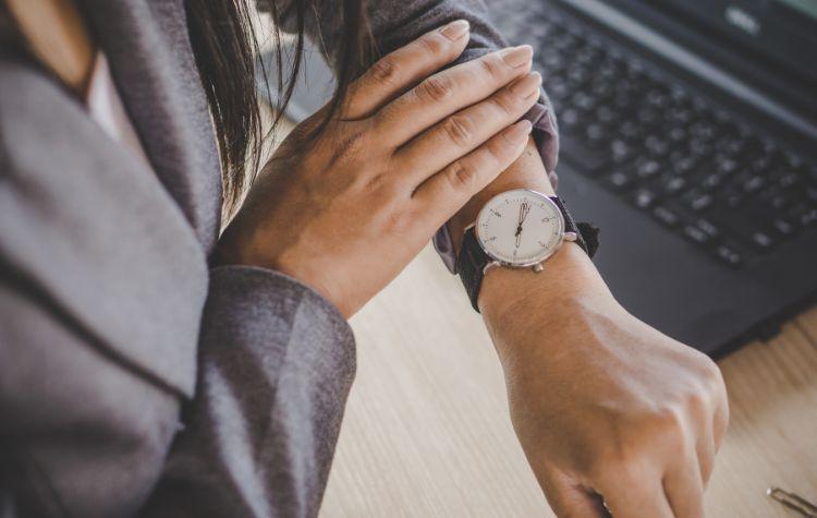 Businesswoman checking watch