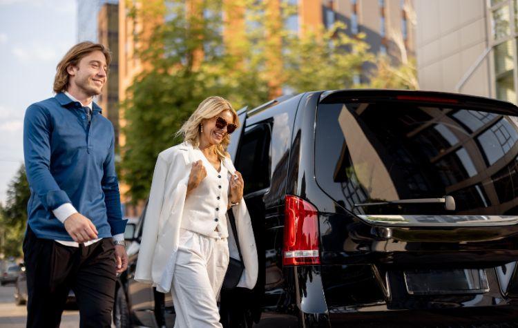 Couple walking near their private ride