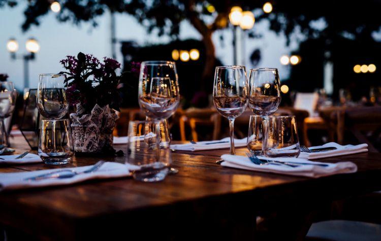 Empty glasses and utensils set up at a fine dining establishment