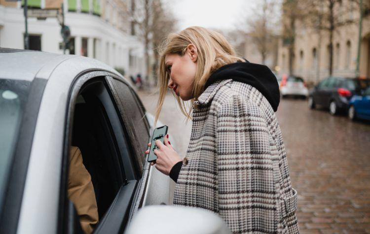 Girl looking for her rideshare driver