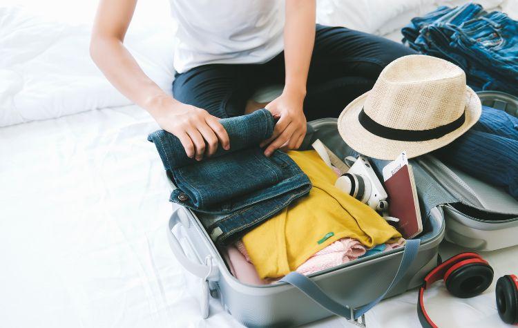 Person packing their suitcase