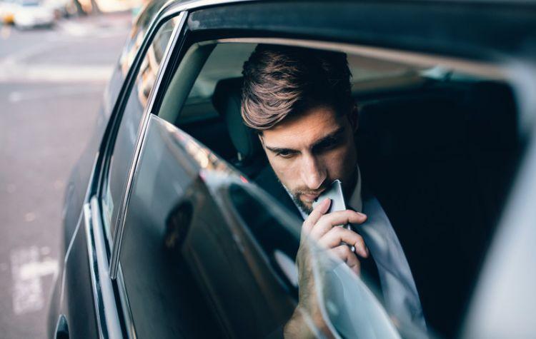 Man sitting in car pondering