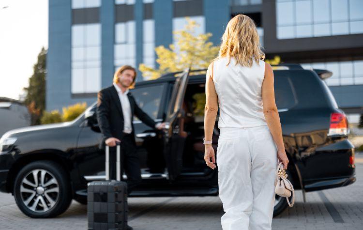 Woman getting into a private car transfer