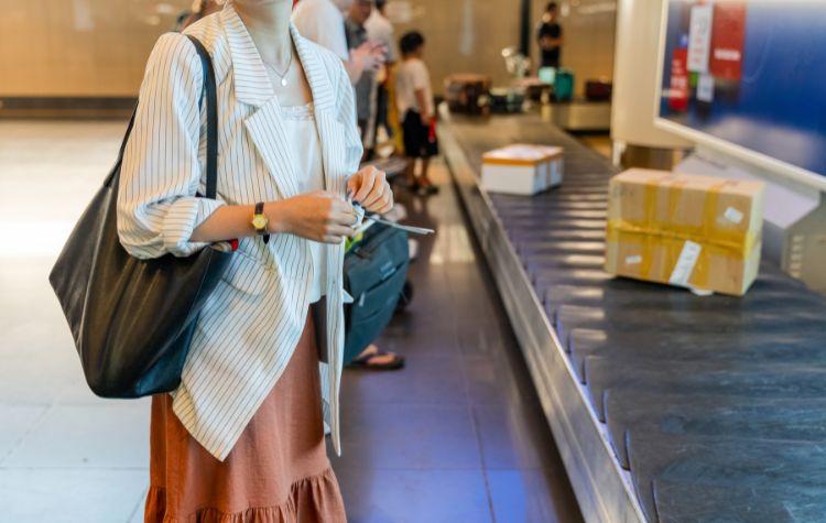 Woman waiting at baggage claim