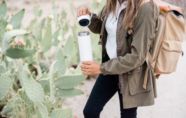 Women bringing her water bottle with her to stay hydrated