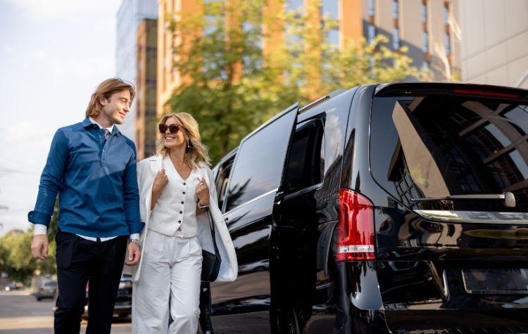 a couple outside their airport transfer